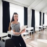 young caucasian woman smiling and looking at P72RQL3 - DIGITOK